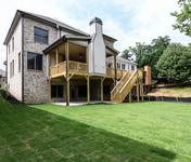 Outdoor Deck with Brick Fireplace in The Aragon built by Waterford Homes in Sandy Springs